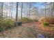 Long driveway leading to the house, surrounded by trees at 1405 Auman Rd, Raleigh, NC 27603