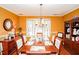 Bright dining room with hardwood floors, chandelier, and bay window at 1408 Kenbrook Dr, Garner, NC 27529