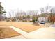 Wider view of the neighborhood showcasing the street and homes from a distance at 1408 Kenbrook Dr, Garner, NC 27529