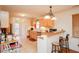 Kitchen with light wood cabinets, breakfast bar, and tile flooring at 1408 Kenbrook Dr, Garner, NC 27529