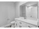 Modern bathroom with white vanity, quartz countertop, and a large mirror at 157 Rainbow Dr, Dunn, NC 28334