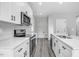 Modern kitchen with white cabinets, quartz countertops and an island at 157 Rainbow Dr, Dunn, NC 28334