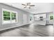 Open concept kitchen with white cabinets, quartz countertops, and stainless steel appliances at 157 Rainbow Dr, Dunn, NC 28334