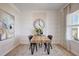 Dining room with modern decor, stylish rug, and large clock hanging above the wooden table at 179 Deodora Ln, Cameron, NC 28326