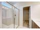 An elegant glass-enclosed shower featuring tiled walls, a built-in seat, and a bright window at 179 Deodora Ln, Cameron, NC 28326