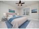 Bedroom with a queen bed, neutral decor, and large window at 1831 Grandmaster Way, Wake Forest, NC 27587