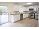 Bright kitchen featuring granite countertops and stainless steel appliances at 1924 Edgeleaf Dr, Willow Springs, NC 27592