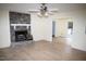 Spacious living room with a stone fireplace and wood-look flooring at 1924 Edgeleaf Dr, Willow Springs, NC 27592