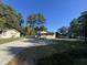 Newly renovated home with gravel driveway and spacious yard at 222 Weston Rd, Garner, NC 27529