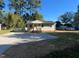 House exterior view with gravel driveway and landscaping at 222 Weston Rd, Garner, NC 27529