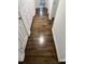 Clean hallway with hardwood floors and access to bedrooms and bathroom at 222 Weston Rd, Garner, NC 27529