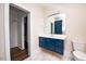 Modern bathroom with blue vanity and floating sink at 2407 Hart Street # B, Durham, NC 27703