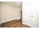 Bedroom with wood-look floors and double door closet at 2407 Hart Street # B, Durham, NC 27703