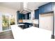Modern kitchen with white quartz countertops and blue cabinetry at 2407 Hart Street # B, Durham, NC 27703