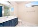 Clean bathroom with a double vanity and marble floors at 2407 Hart Street # B, Durham, NC 27703