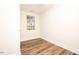 Simple bedroom with wood-look floors and a window at 2407 Hart Street # B, Durham, NC 27703