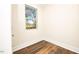 Spacious bedroom with wood-look floors and a window at 2407 Hart Street # B, Durham, NC 27703