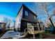 Modern dark-grey home with wood deck and attached stairs at 2407 Hart Street # B, Durham, NC 27703