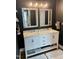 Modern bathroom with double vanity and large mirrors at 26 Wildberry Ct, Rocky Mount, NC 27804
