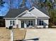 Charming one-story house with gray siding and a welcoming front porch at 26 Wildberry Ct, Rocky Mount, NC 27804