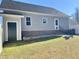Gray house exterior with storage shed and backyard view at 26 Wildberry Ct, Rocky Mount, NC 27804