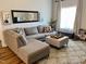 Spacious living room featuring a sectional sofa and large window at 26 Wildberry Ct, Rocky Mount, NC 27804