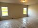 Bedroom with carpet and two windows bringing in natural light at 260 Olivia Crossing Ct # 9, Four Oaks, NC 27524