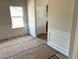Bright dining room features large windows, decorative trim, and access to a doorway at 260 Olivia Crossing Ct # 9, Four Oaks, NC 27524