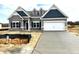 Charming single-Gathering home boasts a modern design, two-car garage, and professional landscaping at 260 Olivia Crossing Ct # 9, Four Oaks, NC 27524