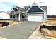 Charming single-Gathering home with an attached two-car garage and a beautifully designed modern exterior at 260 Olivia Crossing Ct # 9, Four Oaks, NC 27524