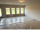 Bright living room with four large windows overlooking the yard at 260 Olivia Crossing Ct # 9, Four Oaks, NC 27524