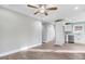 Open concept living area with kitchen views and hardwood floors at 297 Chartres St, Fuquay Varina, NC 27526