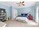 Light blue bedroom with double bed and ceiling fan at 310 Bordeaux Ln, Cary, NC 27511