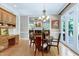 Dining room features wood table and chairs, built-in hutch and hardwood floors at 310 Bordeaux Ln, Cary, NC 27511