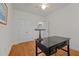 Bedroom with hardwood floors, desk, and window at 312 Ashwick Dr, Efland, NC 27243