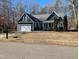 Gray house with white garage door and landscaping at 312 Ashwick Dr, Efland, NC 27243