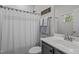 Clean bathroom with gray vanity and shower/tub combo at 313 Page Square Dr, Cary, NC 27513