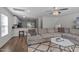 Living room features a sectional sofa and view into the kitchen at 313 Page Square Dr, Cary, NC 27513