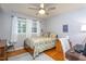 Bedroom with floral bedding and ceiling fan at 3616 Colewood Dr, Raleigh, NC 27604