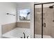 Modern bathroom features a soaking tub with a separate glass enclosed shower at 467 Ravensworth Dr, Garner, NC 27529