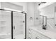 Modern bathroom features a glass enclosed shower and vanity with mirror at 467 Ravensworth Dr, Garner, NC 27529