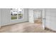 Bright, empty bedroom with light wood floors and white trim at 467 Ravensworth Dr, Garner, NC 27529