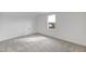 A basic bedroom with one window and a small door on the left side at 467 Ravensworth Dr, Garner, NC 27529
