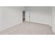 Bedroom with neutral carpet flooring and a white door that's slightly ajar at 467 Ravensworth Dr, Garner, NC 27529