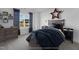 Cozy bedroom with a wooden bed frame and warm, inviting decor at 467 Ravensworth Dr, Garner, NC 27529