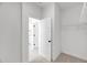 Walk-in closet with shelving, offering ample storage space, and a view into the bathroom at 467 Ravensworth Dr, Garner, NC 27529