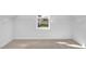 Empty walk-in closet with ample space and a window providing natural light at 467 Ravensworth Dr, Garner, NC 27529