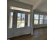 Welcoming entryway with a glass paneled door, leading into a bright, open floor plan with large windows at 467 Ravensworth Dr, Garner, NC 27529