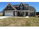 Beautiful two-story home with gray siding, well-maintained lawn, and a two-car garage at 467 Ravensworth Dr, Garner, NC 27529
