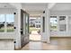 Open foyer with views of the neighborhood through large, bright windows at 467 Ravensworth Dr, Garner, NC 27529